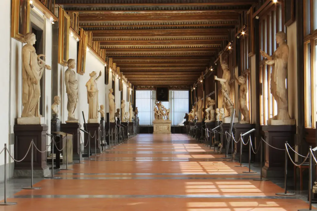 Corridors of the Uffizi Gallery with a few sculptures on the sides